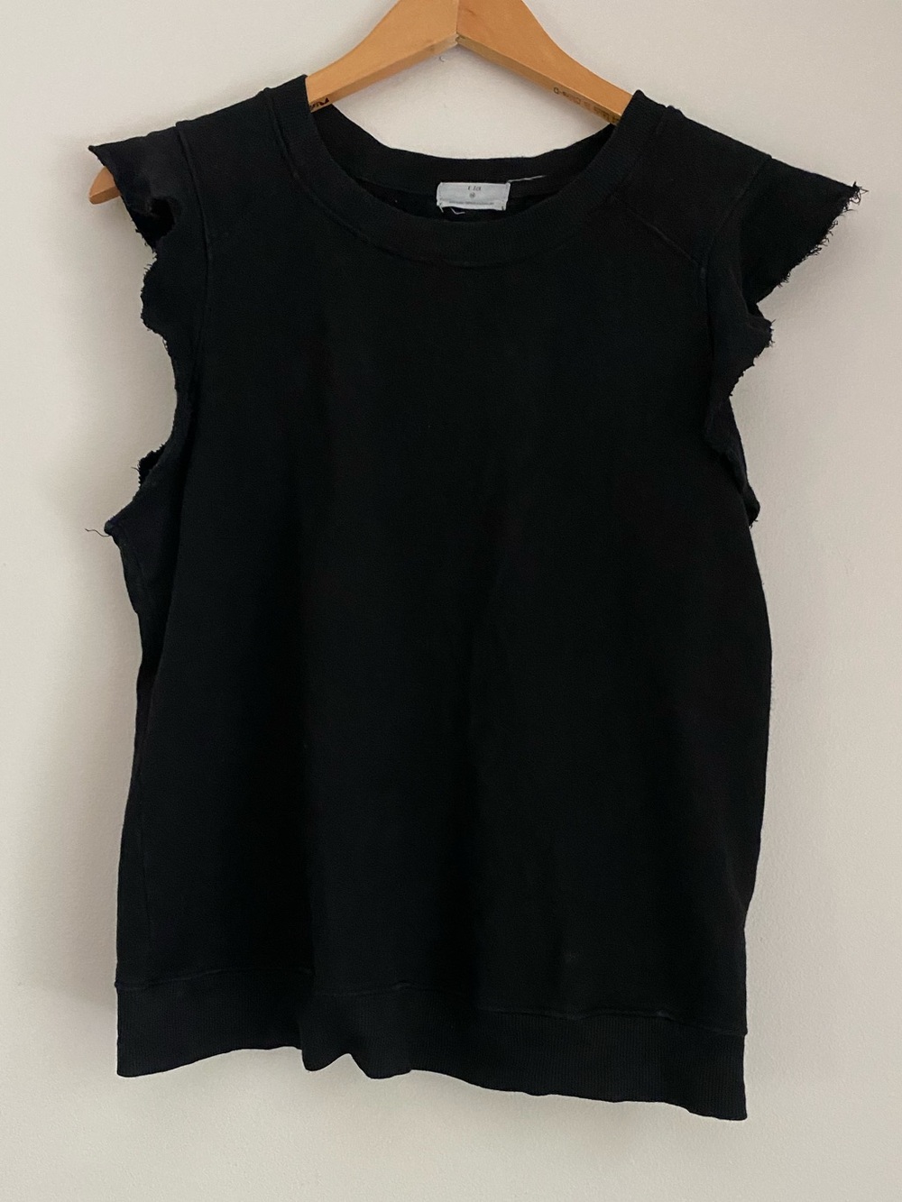 T.la black short sleeve raw hemmed top size medium